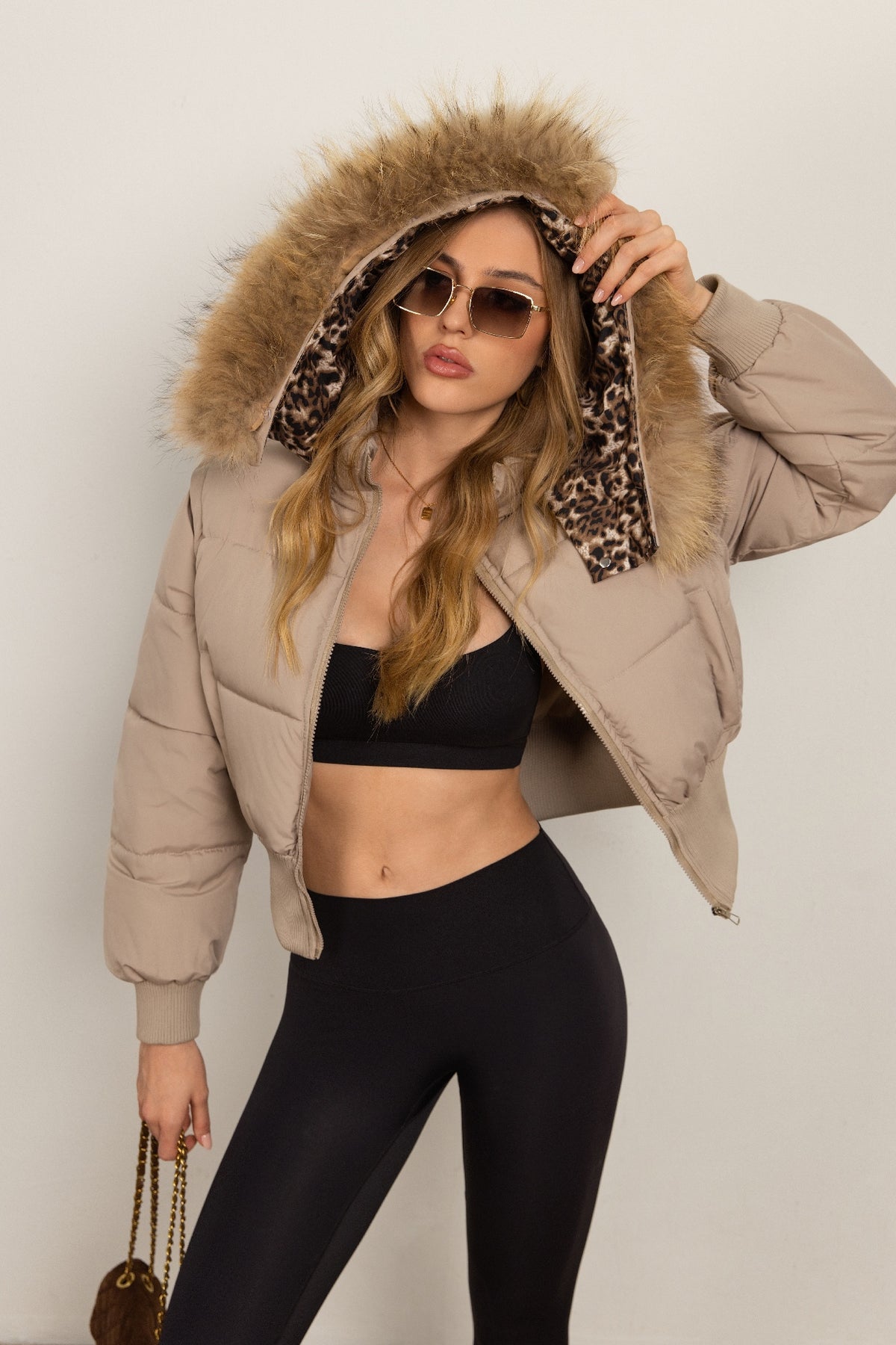 Classic Down Jacket Featuring A Detachable Fur Collar and An Attached Hood.