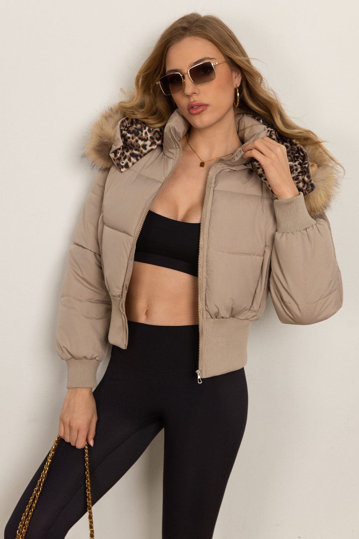 Classic Down Jacket Featuring A Detachable Fur Collar and An Attached Hood.