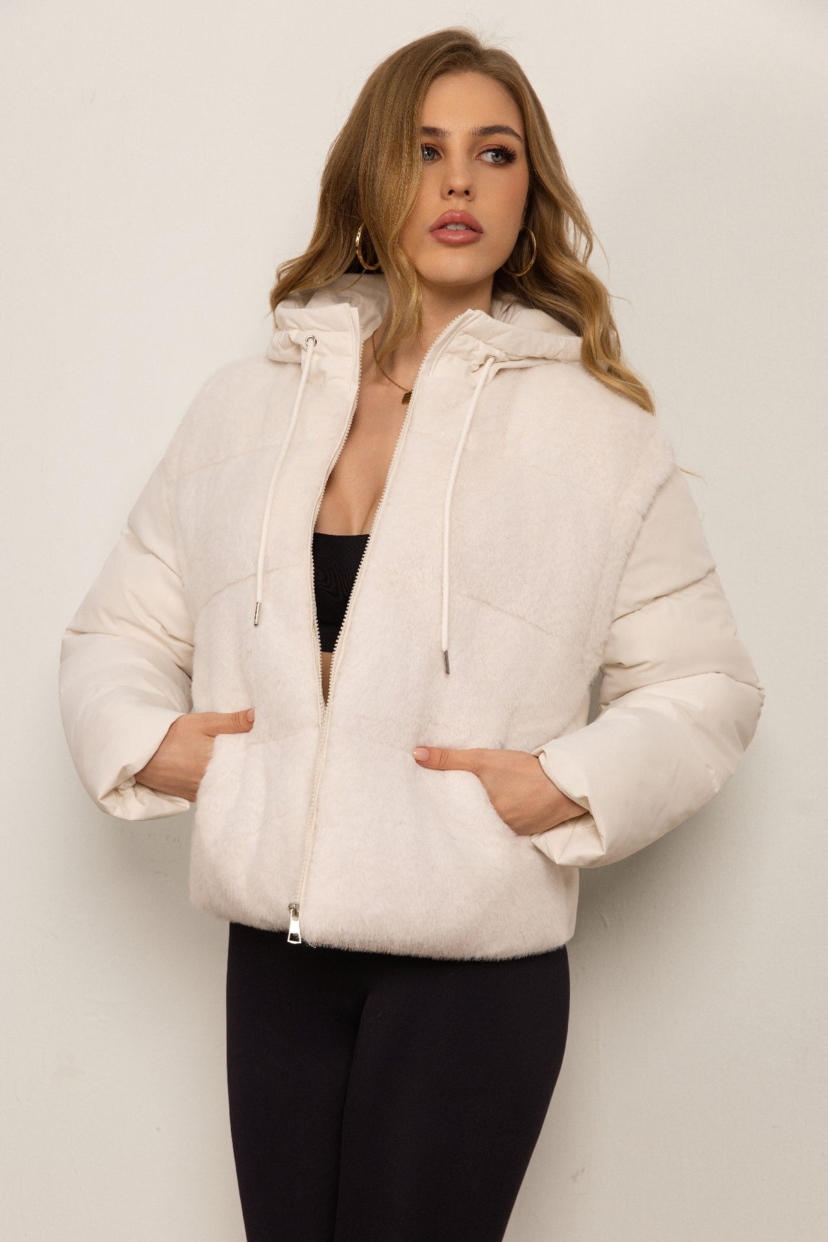 Down jacket with a plush front and detachable sleeves