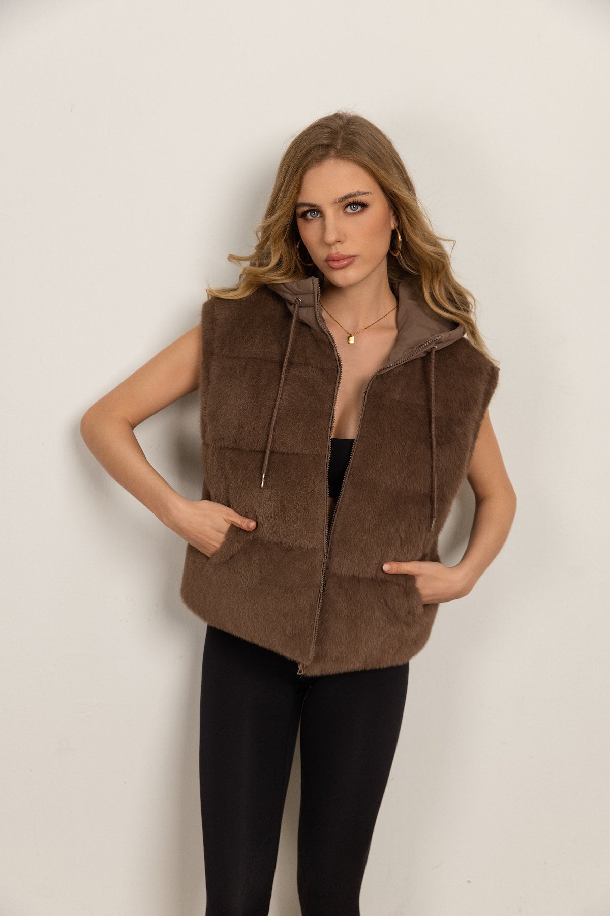 Down jacket with a plush front and detachable sleeves